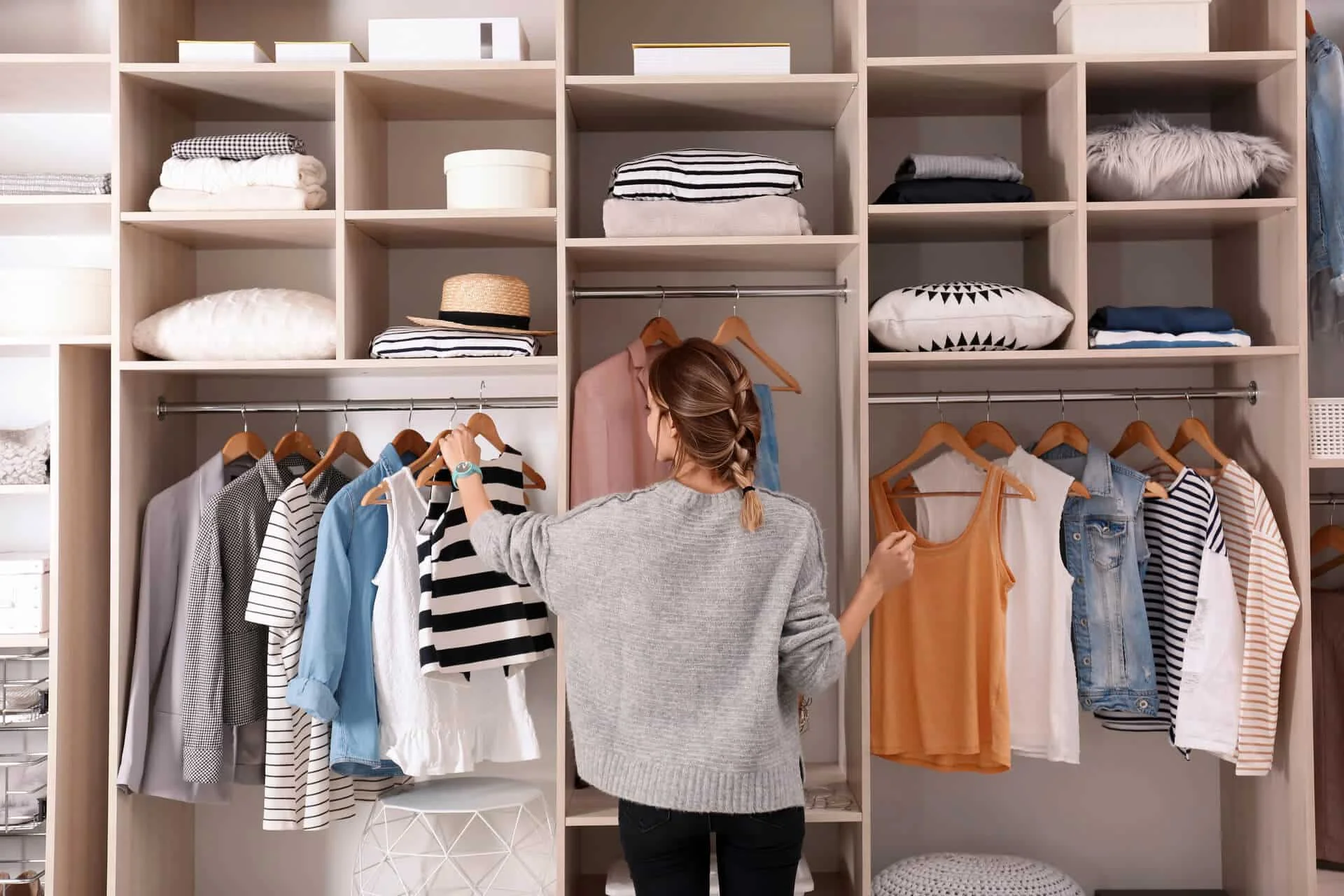 Woman declutters closet